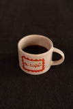 Sisis mug, Le cafè